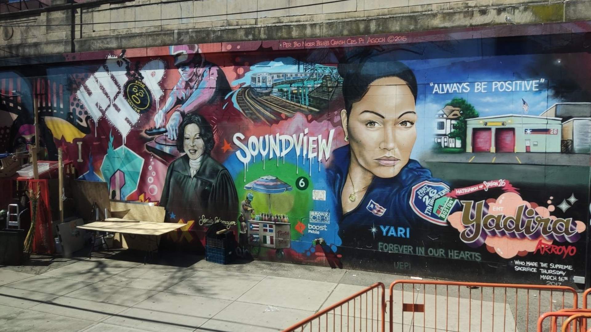 Mural en Soundview, Bronx, Nueva York, con retrato de Yadira Arroyo y escenas del barrio pintadas en un muro urbano.